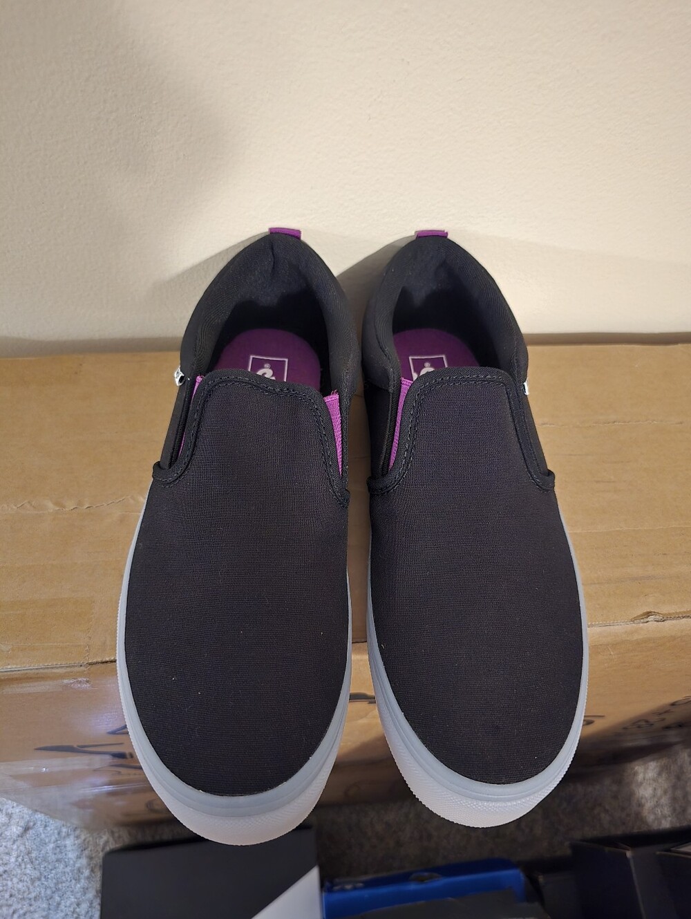 Vans Black Slip-On Sneakers with Pink Accents